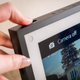 A photo of a person using the physical camera shutter switch on the Echo Show 15